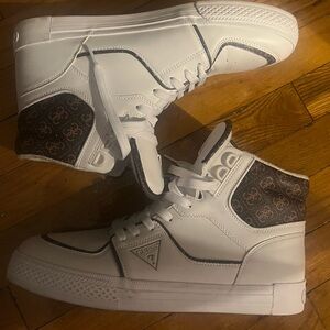 White high top sneakers with brown and gold trim
